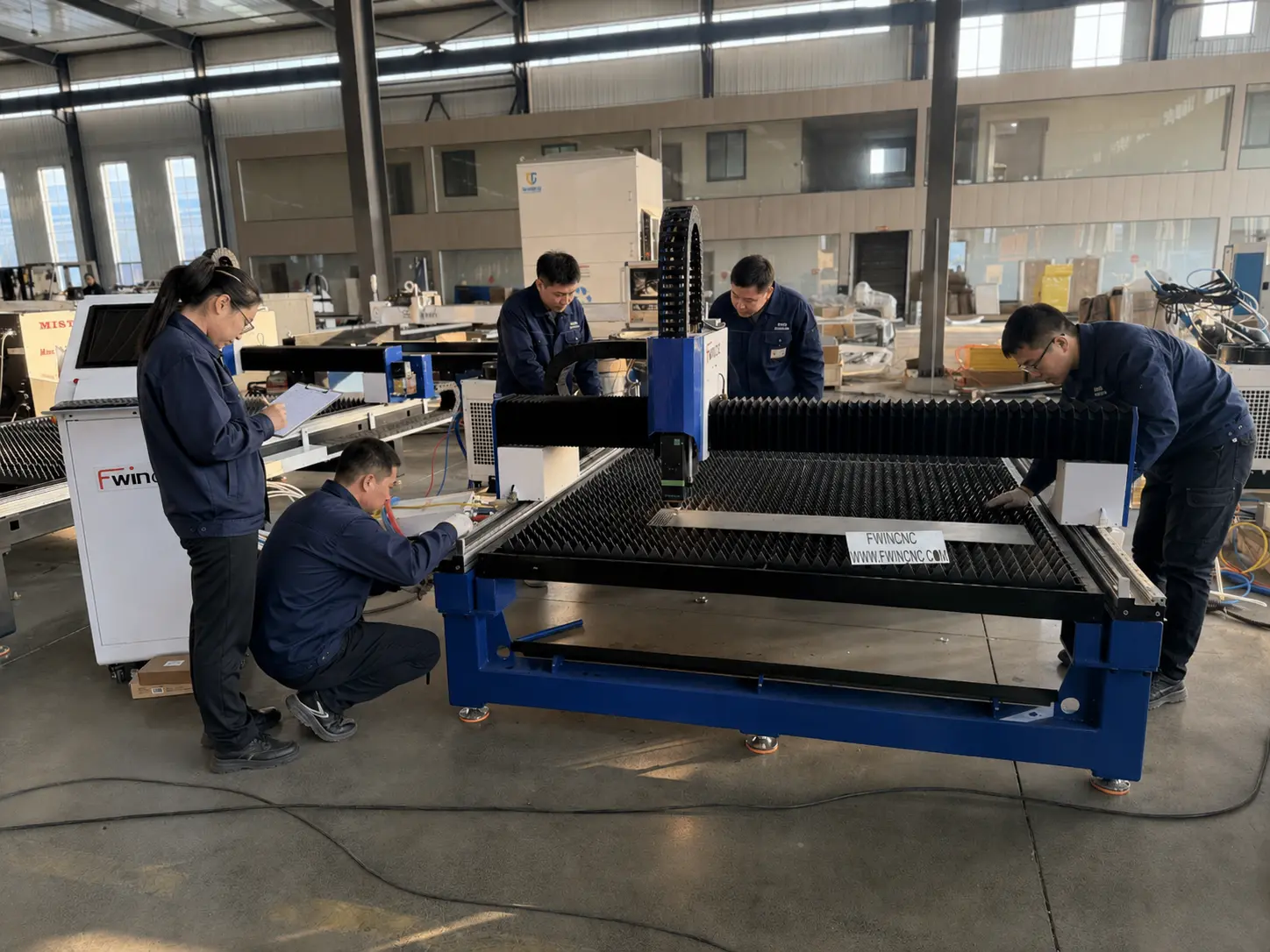 professionally packed Fwincnc machine or a technician performing a final quality check in the factory